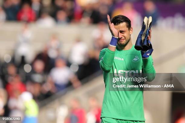Lukasz Fabianski of Swansea City wipes away tears after Swansea suffer relegation to the EFL Sky Bet Championship during the Premier League match...