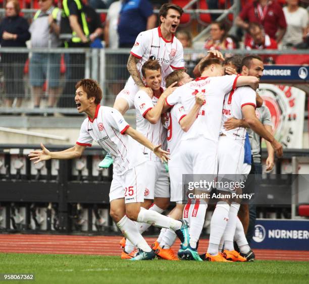 Genki Haraguchi of Fortuna Duesseldorf celebrates victory in the match and winning the Bundesliga 2 championship during the Second Bundesliga match...