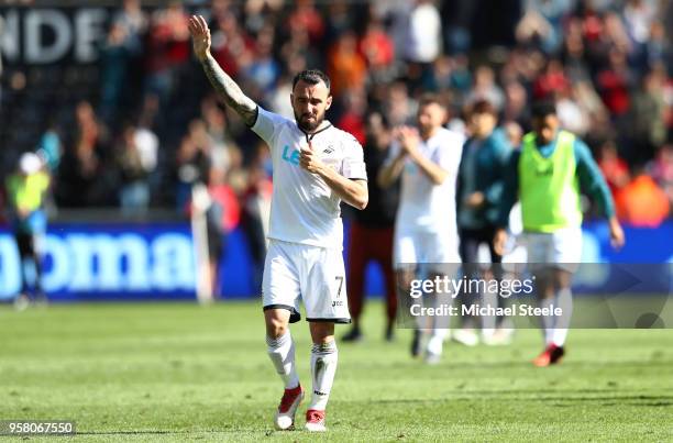 Leon Britton of Swansea City shows appreciation to the fans after the final whistle during the Premier League match between Swansea City and Stoke...