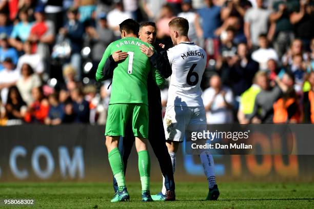 Lukasz Fabianski of Swansea City is embraced by Carlos Carvalhal, Manaager of Swansea City after the Premier League match between Swansea City and...