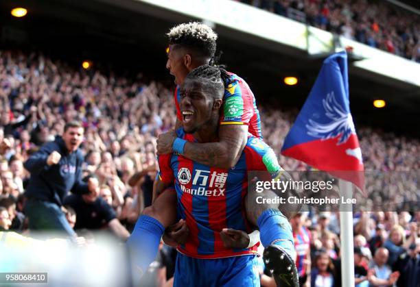 Wilfried Zaha of Crystal Palace celebrates with Patrick van Aanholt of Crystal Palace after scoring his sides second goal during the Premier League...