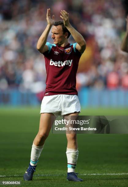 Mark Noble of West Ham United applauds fans during the Premier League match between West Ham United and Everton at London Stadium on May 13, 2018 in...