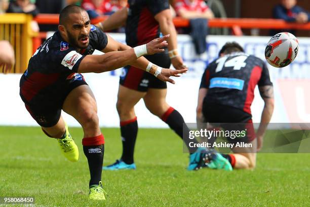 Thomas Leuluai of Wigan Warriors passes the ball during round six of the Ladbrokes Challenge Cup at KCOM Craven Park on May 13, 2018 in Hull, England.