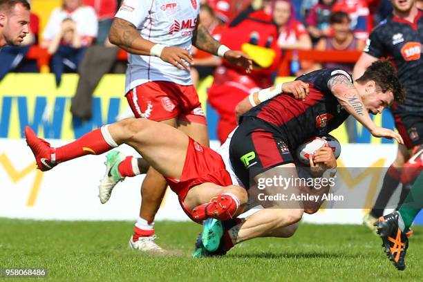 John Bateman of Wigan Warriors is brought down during round six of the Ladbrokes Challenge Cup at KCOM Craven Park on May 13, 2018 in Hull, England.