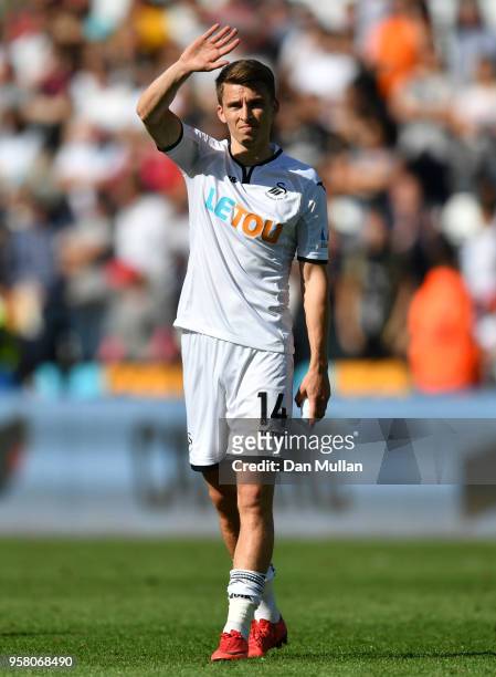 Tom Carroll of Swansea City shows appreciation to the fans after the Premier League match between Swansea City and Stoke City at Liberty Stadium on...