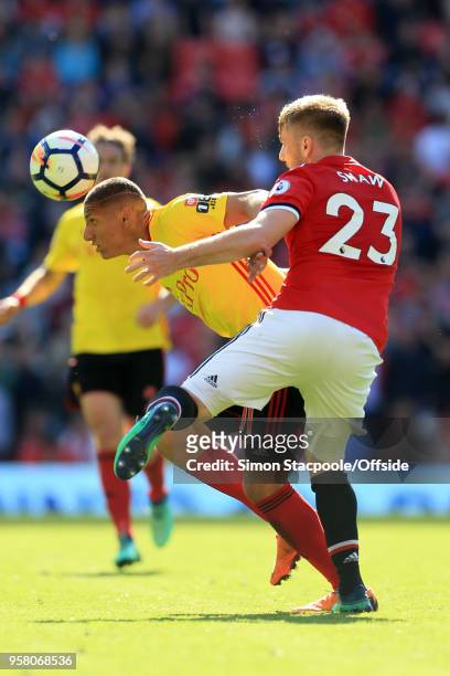 Richarlison of Watford battles with Luke Shaw of Man Utd during the Premier League match between Manchester United and Watford at Old Trafford on May...