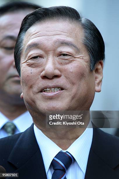 Secretary General of the ruling Democratic Party of Japan Ichiro Ozawa reacts while he is surrounded by the reporters to answer the questions as he...