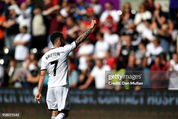 Leon Britton of Swansea City shows appreciation to the fans after the Premier League match between Swansea City and Stoke City at Liberty Stadium on...