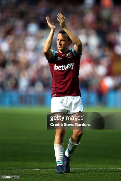 Mark Noble of West Ham United shows appreciation to the fans after the Premier League match between West Ham United and Everton at London Stadium on...