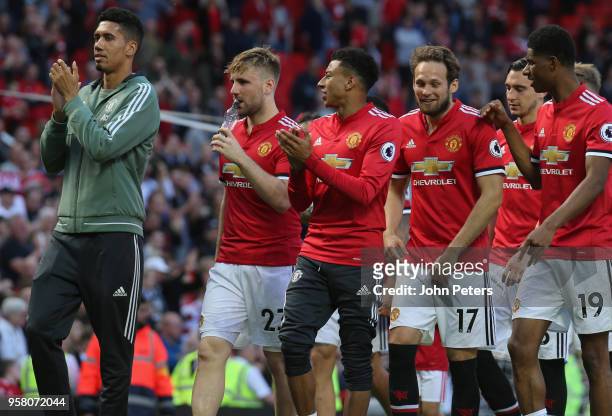 Chris Smalling, Luke Shaw, Jesse Lingard, Daley Blind and Marcus Rashford of Manchester United take part in a lap of honour after the Premier League...
