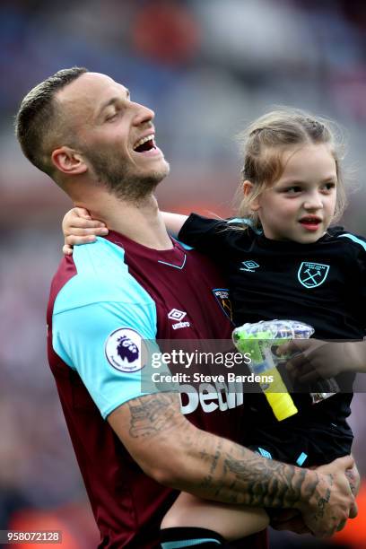 Marko Arnautovic of West Ham United enjoys the lap of honour with his child after the Premier League match between West Ham United and Everton at...