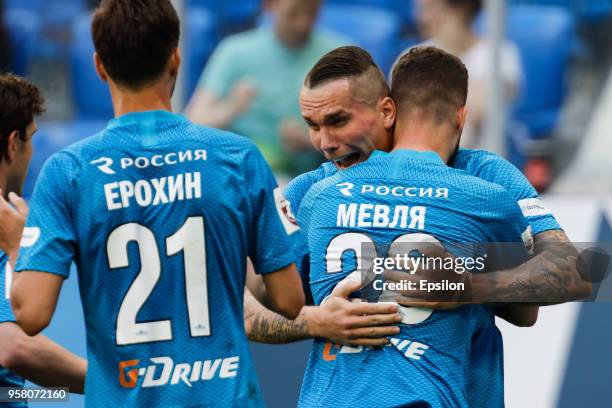 Anton Zabolotny of FC Zenit Saint Petersburg celebrates his goal with teammates during the Russian Football League match between FC Zenit Saint...