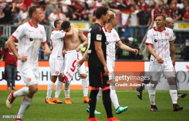 Kaan Ayhan of Fortuna Duesseldorf is congratulated after scoring the winning goal and securing victory in the match and winning the Bundesliga 2...