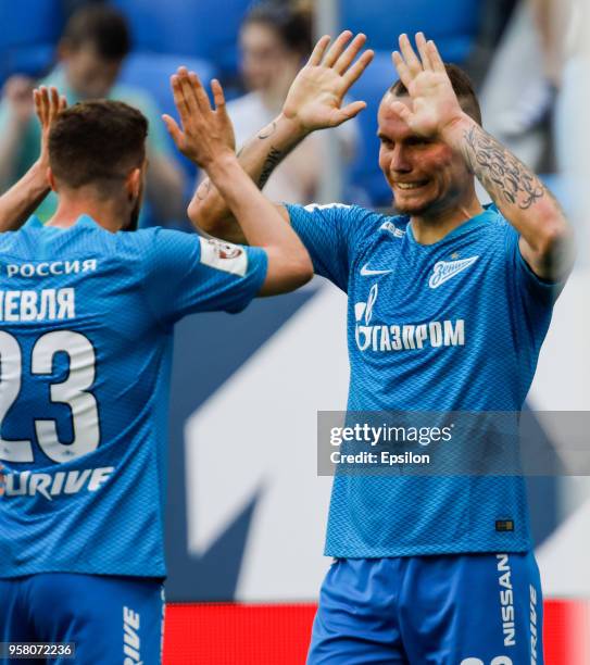 Anton Zabolotny of FC Zenit Saint Petersburg celebrates his goal with Miha Mevlja during the Russian Football League match between FC Zenit Saint...