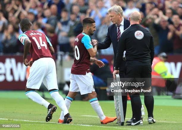 David Moyes, Manager of West Ham United shakes the hand of Manuel Lanzini of West Ham United as he is subtituted during the Premier League match...