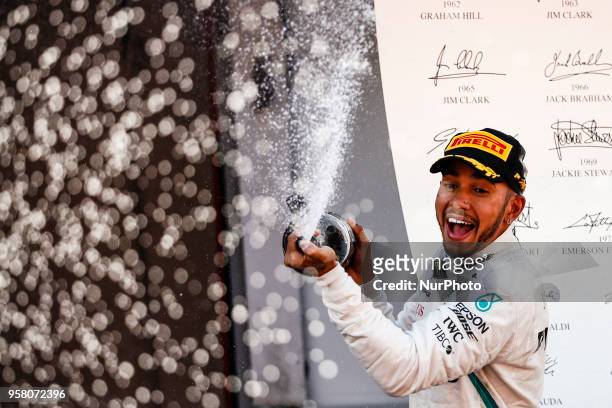Lewis Hamilton from Great Britain Mercedes W09 Hybrid EQ Power+ team Mercedes GP celebrating his victory at the podium during the Spanish Formula One...