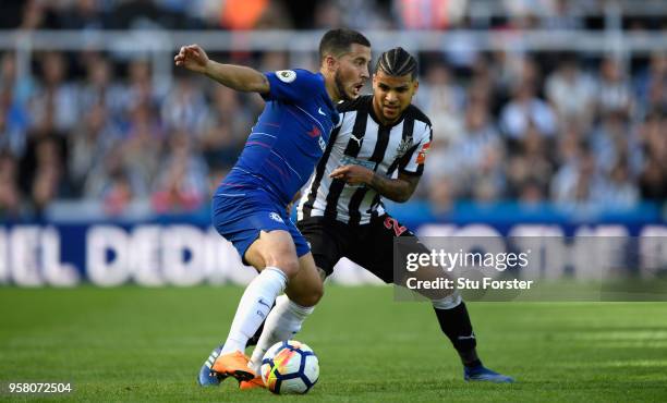 Chelsea player Eden Hazard holds off the challenge od DeAndre Yedlin of Newcastle during the Premier League match between Newcastle United and...