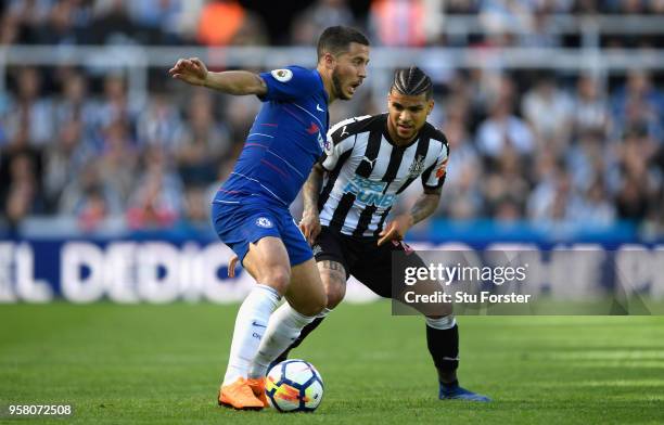 Chelsea player Eden Hazard holds off the challenge od DeAndre Yedlin of Newcastle during the Premier League match between Newcastle United and...
