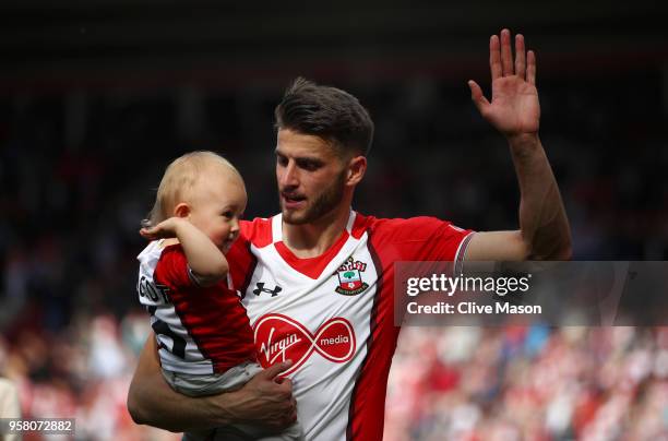 Wesley Hoedt of Southampton enjoys the lap of honour with his child after the Premier League match between Southampton and Manchester City at St...