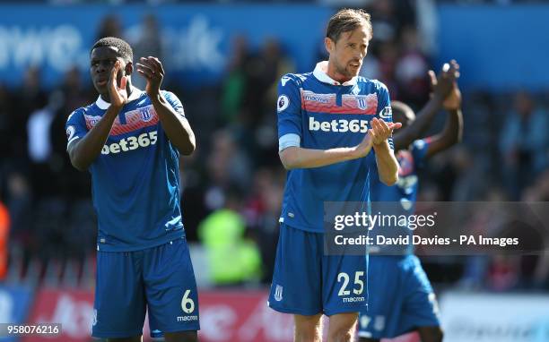 Stoke City's Peter Crouch and Kurt Zouma applaud the fans after the final whistle during the Premier League match at the Liberty Stadium, Swansea.