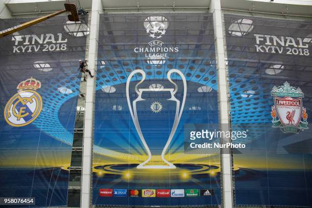 Workers cover NSC Olimpiyskiy with banners for the Champions League in Kyiv, Ukraine, May 13, 2018. Kyiv prepares to host UEFA Women's Champions...