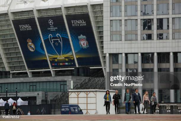 People walk near NSC Olimpiyskiy in Kyiv, Ukraine, May 13, 2018. Kyiv prepares to host UEFA Women's Champions League final between Wolfsburg and Lyon...