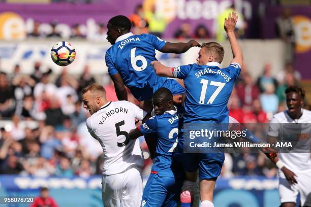 Kurt Zouma of Stoke City and Mike Van Der Hoorn of Swansea City and Badou Ndiaye of Stoke City and Ryan Shawcross of Stoke City contest a header from...