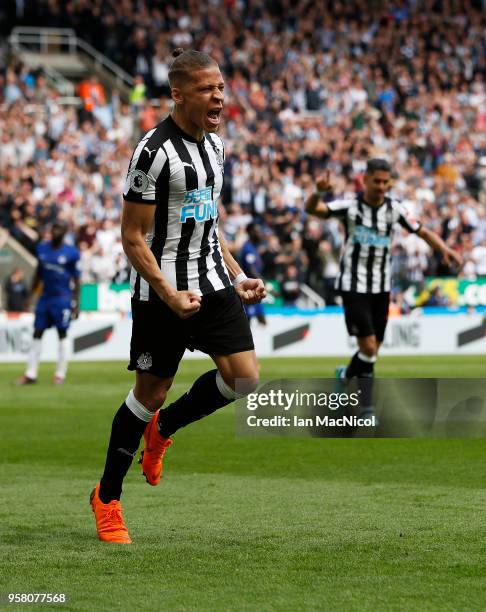 Dwight Gayle of Newcastle United celebrates after he score the opening goal during the Premier League match between Newcastle United and Chelsea at...