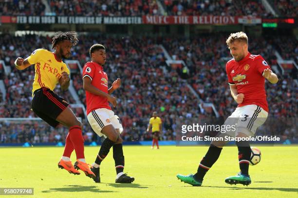 Nathaniel Chalobah of Watford shoots past Marcus Rashford of Man Utd and Luke Shaw of Man Utd during the Premier League match between Manchester...