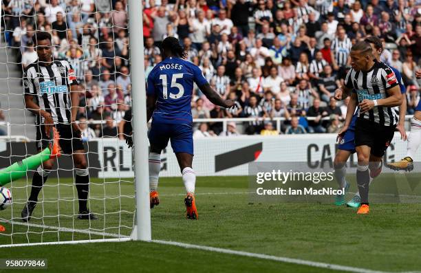 Dwight Gayle of Newcastle United scores the opening goal during the Premier League match between Newcastle United and Chelsea at St. James Park on...