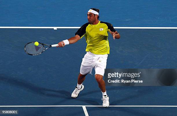 Marcos Baghdatis of Cyrprus plays a forehand in his men's final match against Richard Gasquet of France during day seven of the 2010 Medibank...