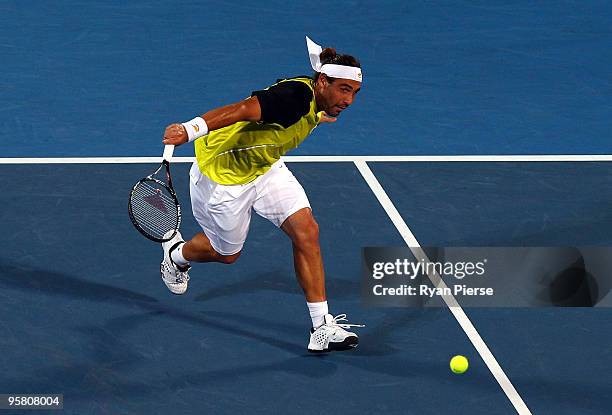 Marcos Baghdatis of Cyrprus plays a backhand in his men's final match against Richard Gasquet of France during day seven of the 2010 Medibank...