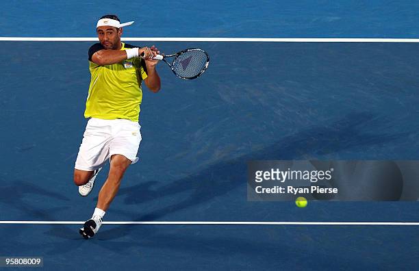 Marcos Baghdatis of Cyrprus plays a forehand in his men's final match against Richard Gasquet of France during day seven of the 2010 Medibank...