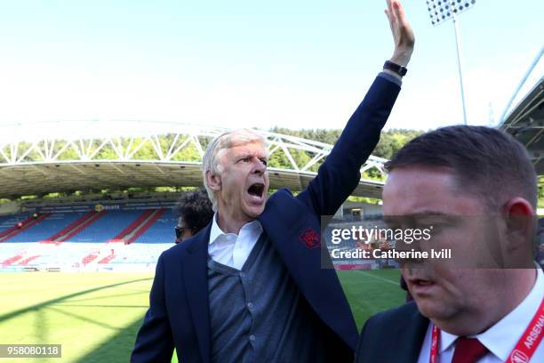 Arsene Wenger, Manager of Arsenal shows appreciation to the fans after the Premier League match between Huddersfield Town and Arsenal at John Smith's...