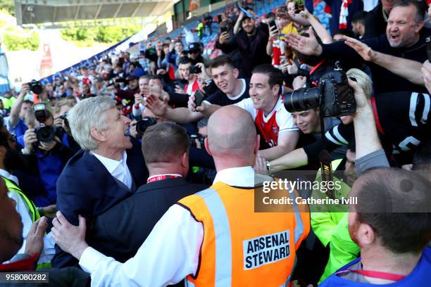 Arsene Wenger, Manager of Arsenal shows appreciation to the fans after the Premier League match between Huddersfield Town and Arsenal at John Smith's...