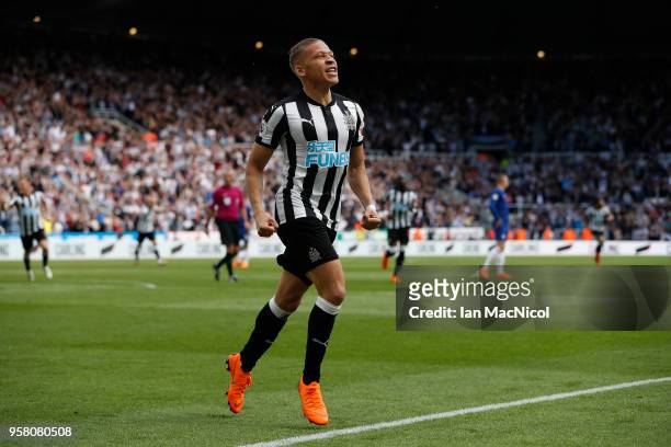 Dwight Gayle of Newcastle United celebrates after he score the opening goal during the Premier League match between Newcastle United and Chelsea at...