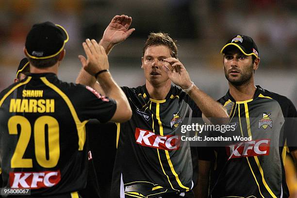 Ashley Noffke of the Warriors celebrates after taking a wicket during the Twenty20 Big Bash match between the Queensland Bulls and the Western...