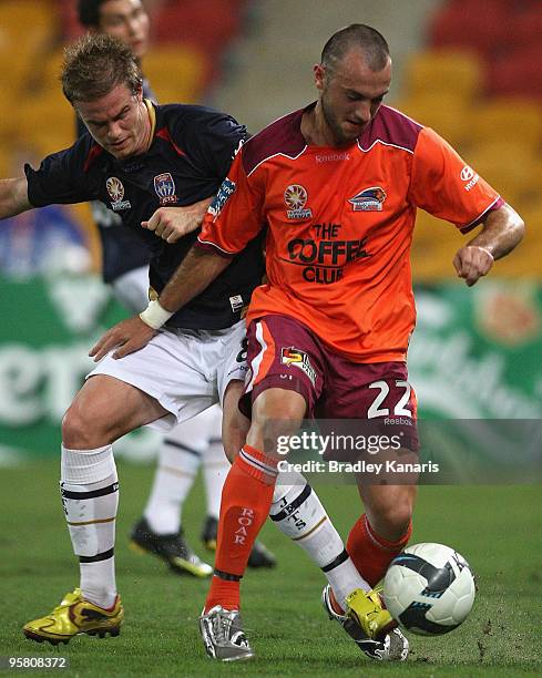 Ivan Franjic of the Roar is pressured by the Jets defence during the round 23 A-League match between the Brisbane Roar and the Newcastle Jets at...