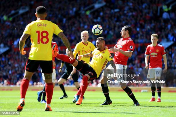 Roberto Pereyra of Watford attempts an overhead kick past Matteo Darmian of Man Utd during the Premier League match between Manchester United and...