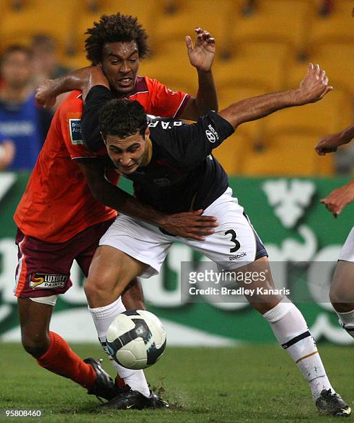 Isaka Cernak of the Roar and Adam D'Apuzzo of the Jets during the round 23 A-League match between the Brisbane Roar and the Newcastle Jets at Suncorp...