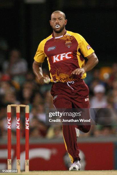 Andrew Symonds of the Bulls bowls during the Twenty20 Big Bash match between the Queensland Bulls and the Western Australian Warriors at The Gabba on...