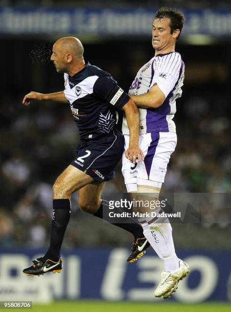 Kevin Muscat of the Victory has front position over Jamie Harnwell of the Glory during the round 23 A-League match between the Melbourne Victory and...