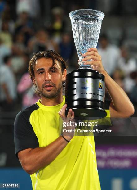 Marcos Baghdatis of Cyprus holds the trophy aloft after winning his men's final against Richard Gasquet of France during day seven of the 2010...