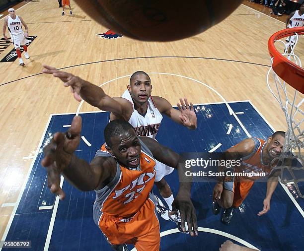 Jason Richardson of the Phoenix Suns puts up a shot against Al Horford of the Atlanta Hawks on January 15, 2010 at Philips Arena in Atlanta, Georgia....