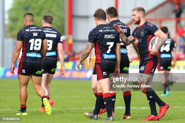 Sam Tomkins of Wigan Warriors walks with the ball after having scored a try during round six of the Ladbrokes Challenge Cup at KCOM Craven Park on...