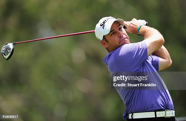 Hennie Otto of South Africa plays his tee shot on the fourth hole during the third round of the Joburg Open at Royal Johannesburg and Kensington Golf...