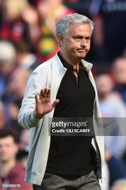 Manchester United's Portuguese manager Jose Mourinho waves as he leaves the pitch after the final whistle in the English Premier League football...