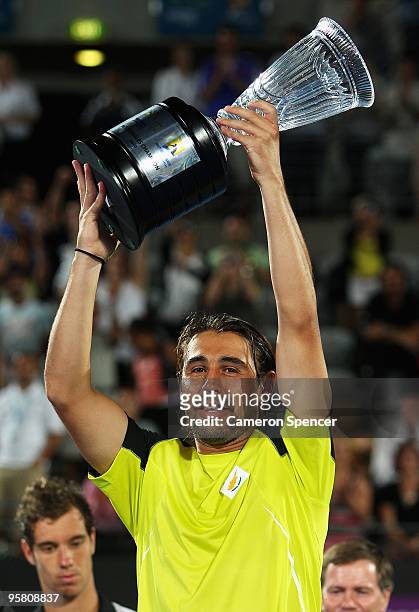 Marcos Baghdatis of Cyprus holds the trophy aloft after winning his men's final against Richard Gasquet of France during day seven of the 2010...