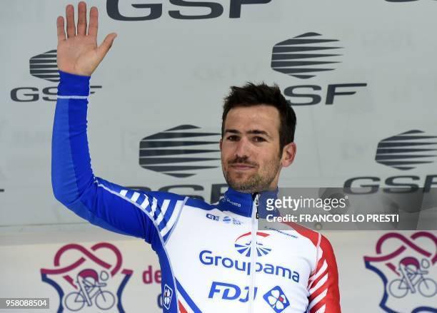 Winner of the 6th and last stage Groupama - FDJ's Frewnch rider Olivier Le Gac celebrate his victory on the podium of the 2018 Four Days of Dunkirk,...