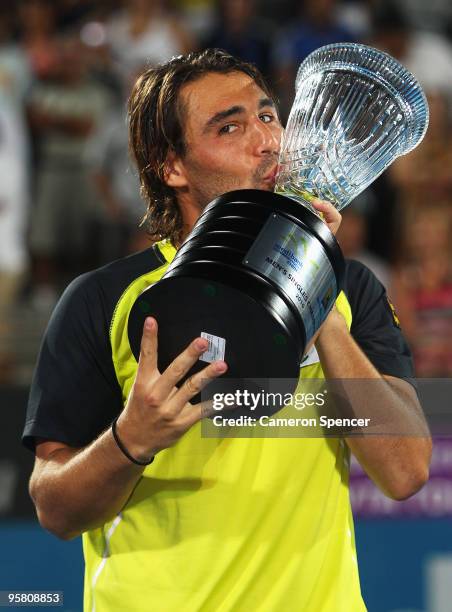 Marcos Baghdatis of Cyprus kisses the trophy after winning his men's final against Richard Gasquet of France during day seven of the 2010 Medibank...